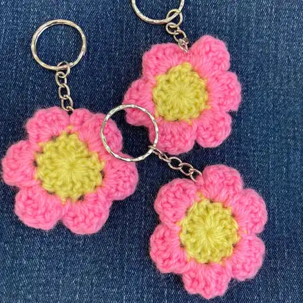 Three pink and yellow flower keyrings