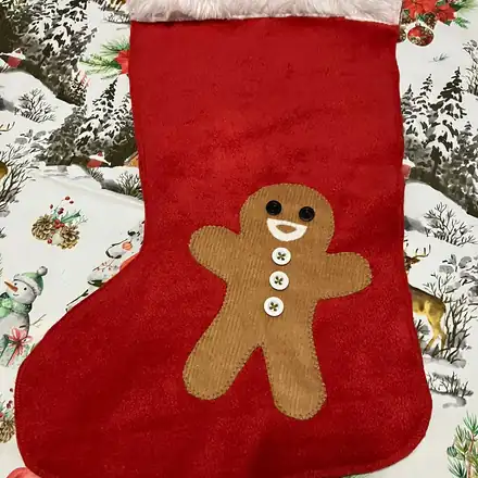 Red Christmas stocking with a gingerbread man